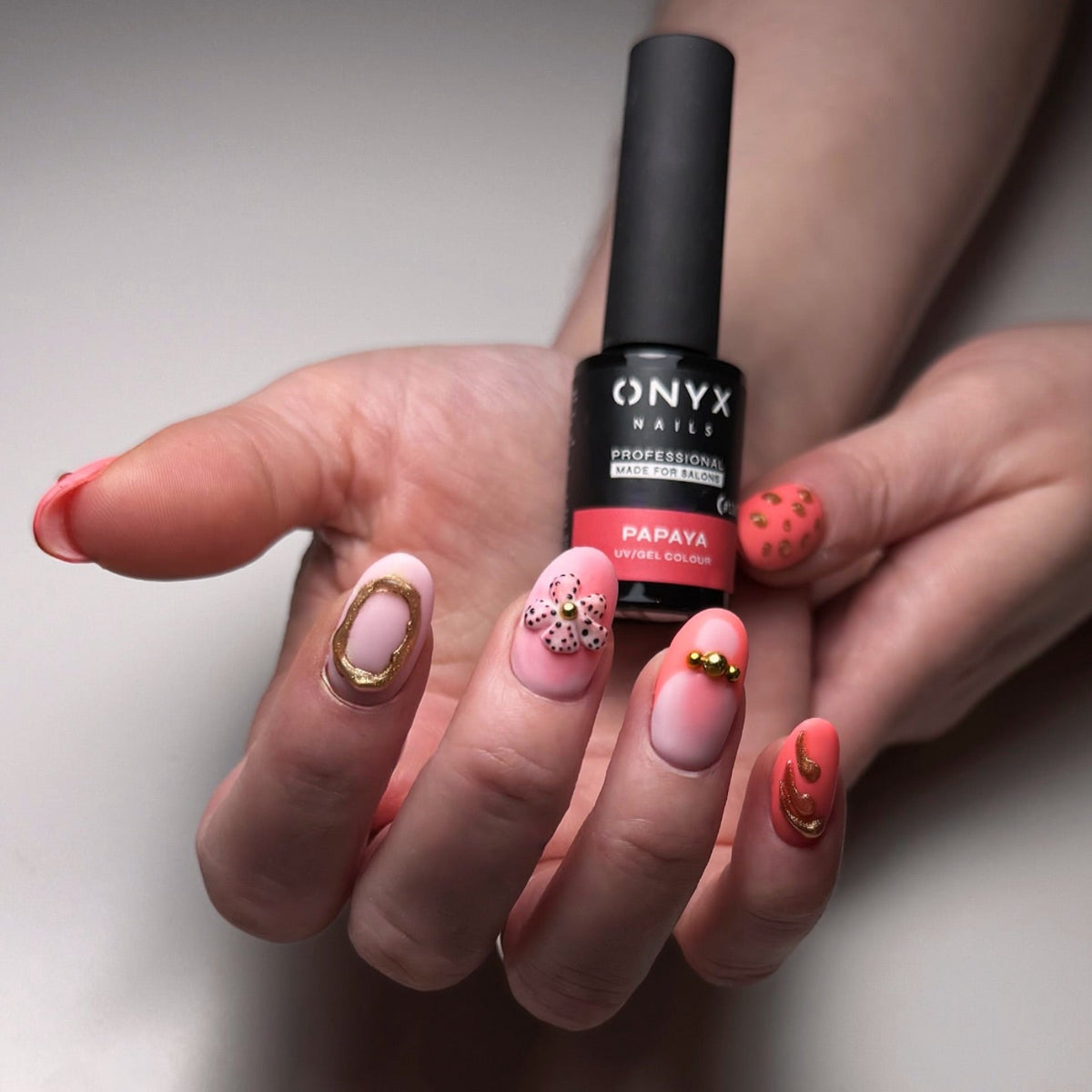 Papaya nails with gold details