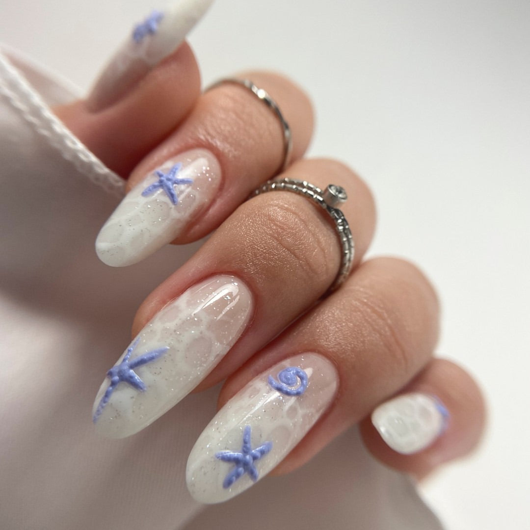 Milky nails with blue starfish