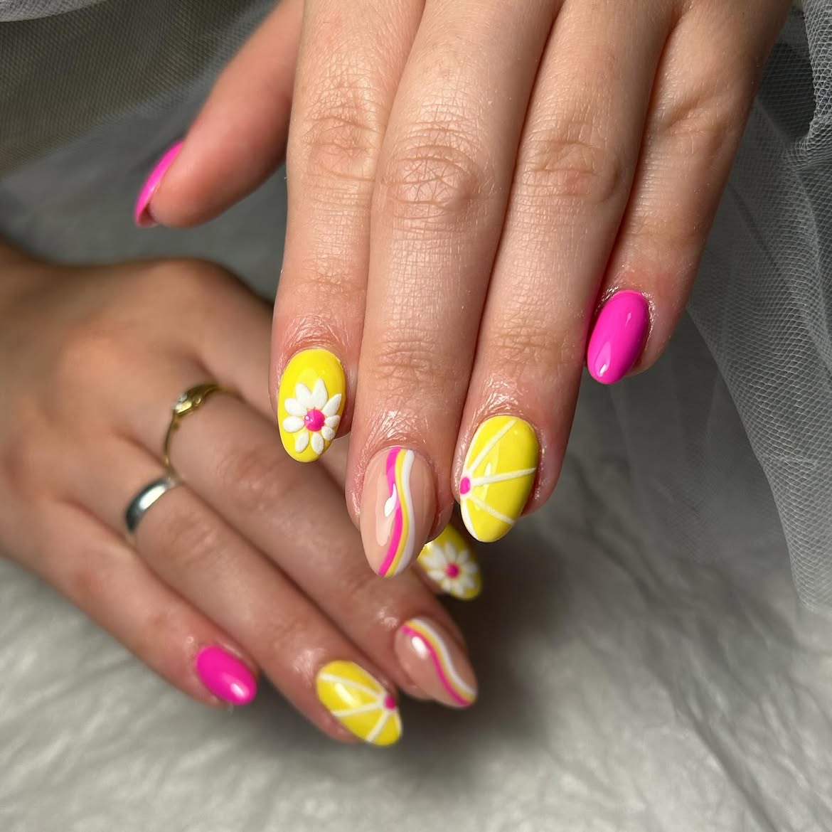 Yellow and pink nails with lemons and flowers