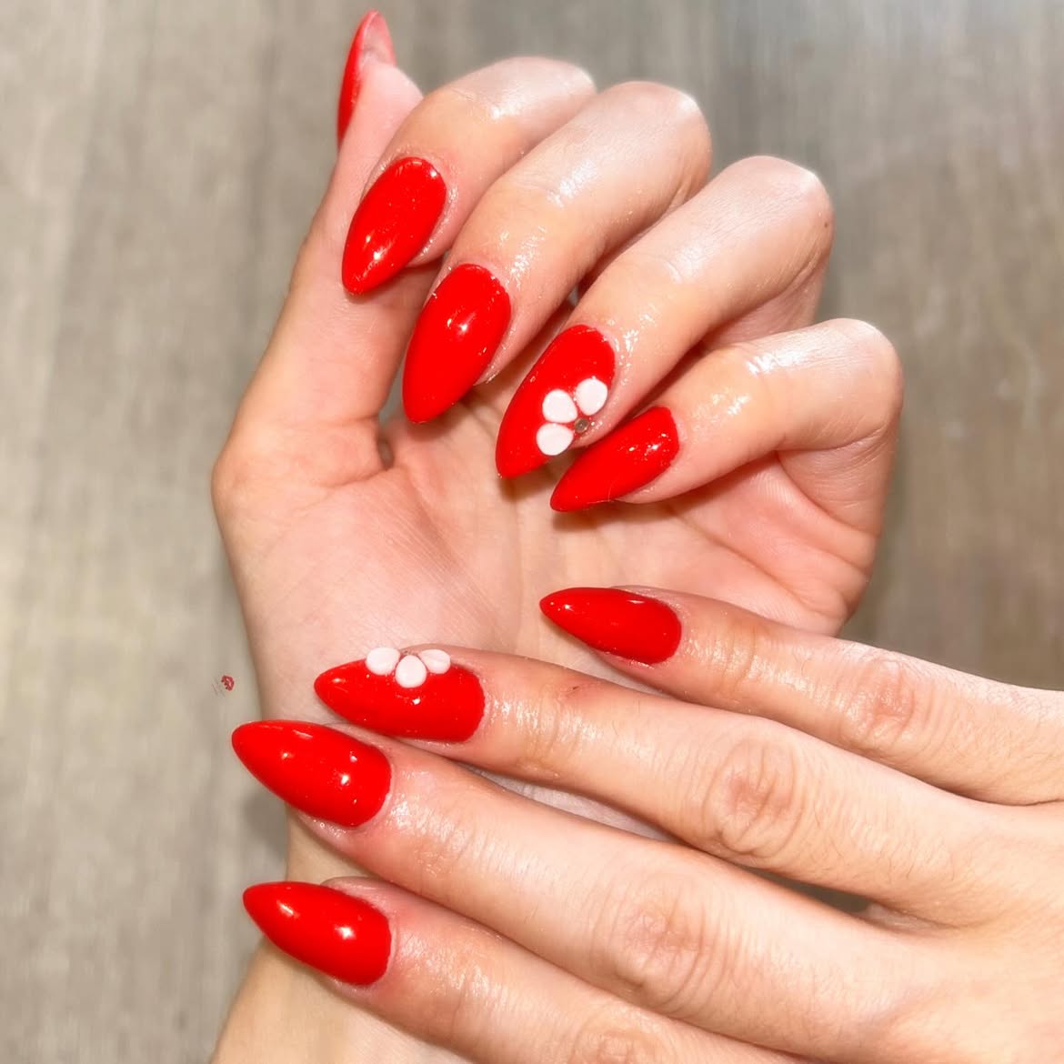 Red nails with white pearls