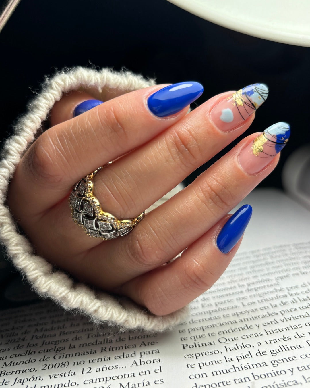 Blue nails with gold accents